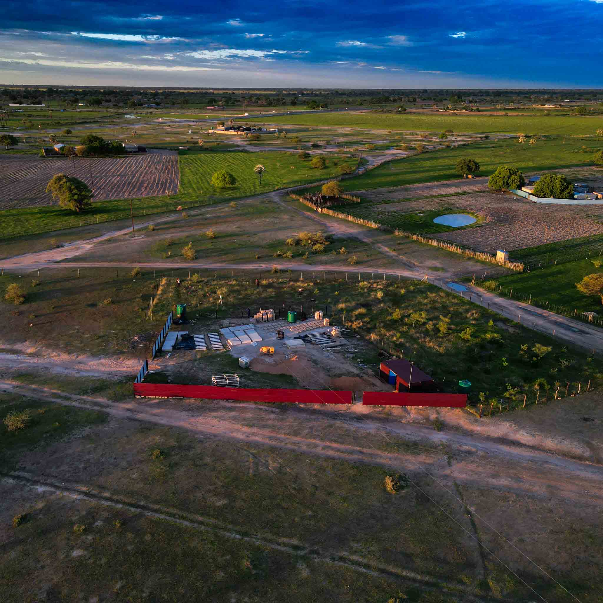 Top-down view of turquoise ocean waves crashing on rocks